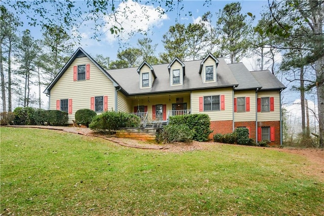 cape cod-style house with a porch and a front lawn