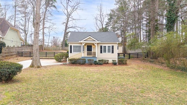 bungalow with fence and a front lawn