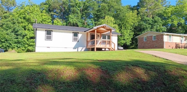 86 Martin Luther King Jr Dr, Jefferson, GA 30549 - rear view of property featuring crawl space, a lawn, brick siding, and a porch