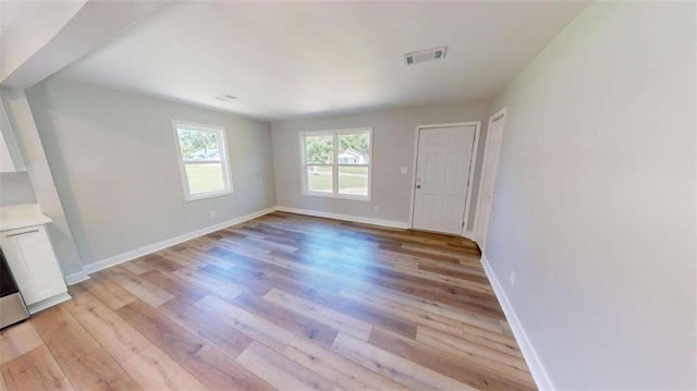 86 Martin Luther King Jr Dr, Jefferson, GA 30549 - unfurnished living room with light wood-style floors and baseboards