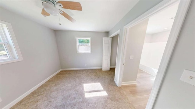 86 Martin Luther King Jr Dr, Jefferson, GA 30549 - unfurnished bedroom featuring baseboards, a ceiling fan, and light colored carpet