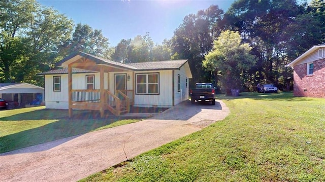 86 Martin Luther King Jr Dr, Jefferson, GA 30549 - view of front of home featuring concrete driveway, a front yard, crawl space, and a porch