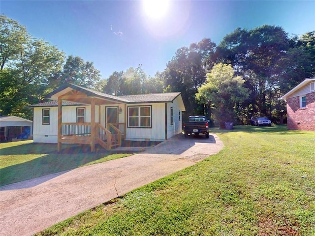 86 Martin Luther King Jr Dr, Jefferson, GA 30549 - view of front of home with crawl space, a front lawn, a porch, and concrete driveway