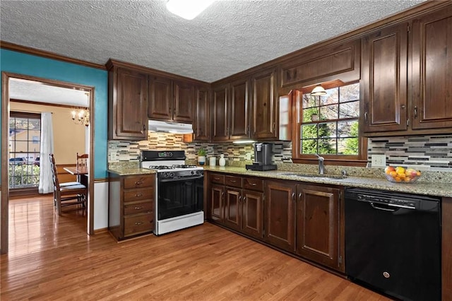 kitchen with dishwasher, sink, white gas range oven, light stone countertops, and ornamental molding