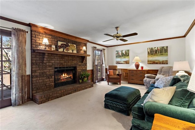 living room featuring a fireplace, light colored carpet, ceiling fan, and ornamental molding