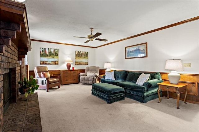 living room featuring a fireplace, carpet floors, ceiling fan, and ornamental molding