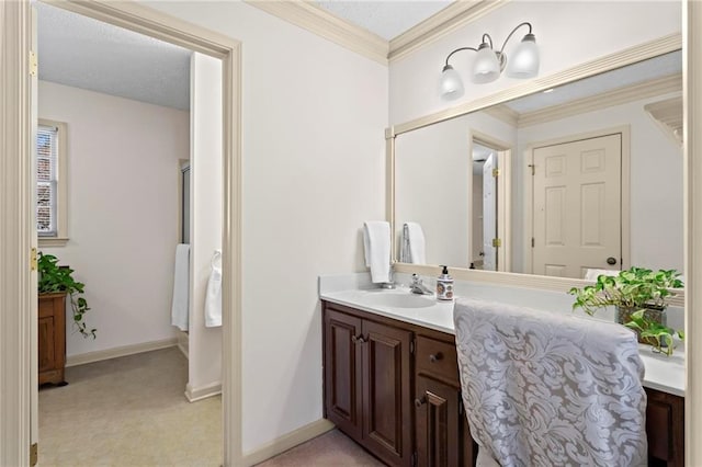 bathroom with vanity and crown molding