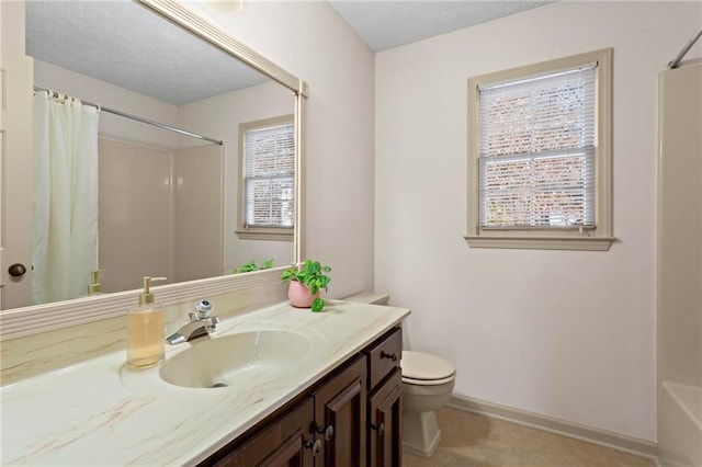 full bathroom with vanity, toilet, and shower / tub combo with curtain