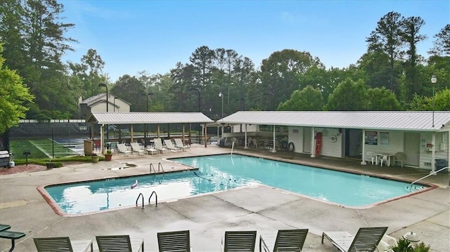 view of swimming pool featuring a patio area