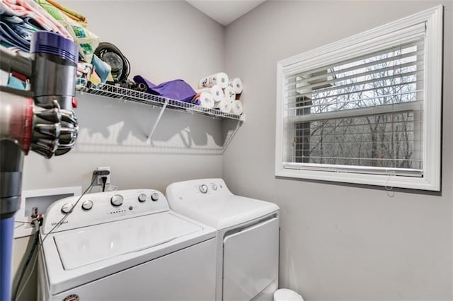 laundry area with laundry area and independent washer and dryer