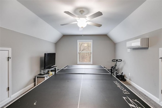 rec room with lofted ceiling, a wall unit AC, and baseboards