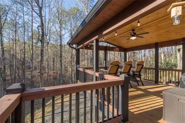 wooden deck with ceiling fan