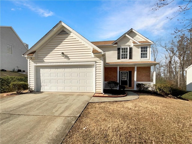 front of property with covered porch and a garage