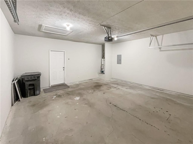 garage featuring electric panel and a garage door opener