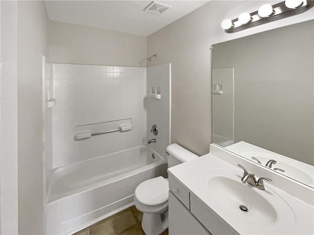 full bathroom featuring toilet, tile patterned floors, bathing tub / shower combination, and vanity