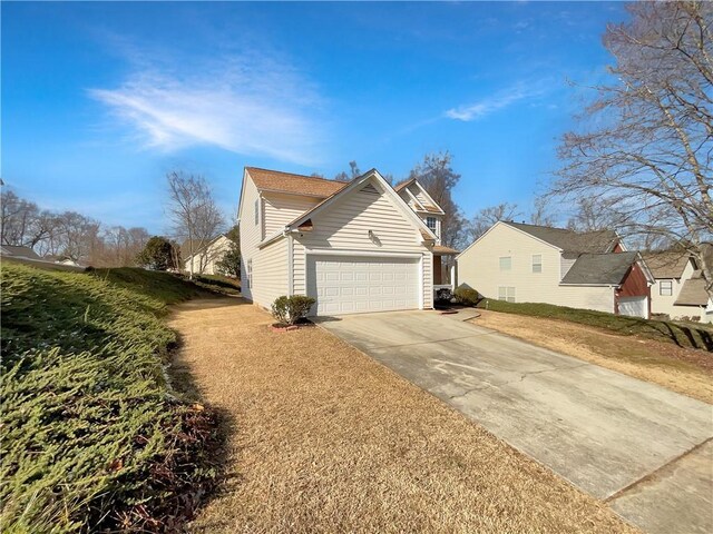 view of side of home with a lawn