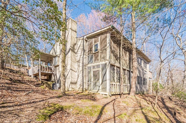 200 Villa Rd Unit 103, Jasper, GA 30143 - view of property exterior with a chimney, a sunroom, and a wooden deck