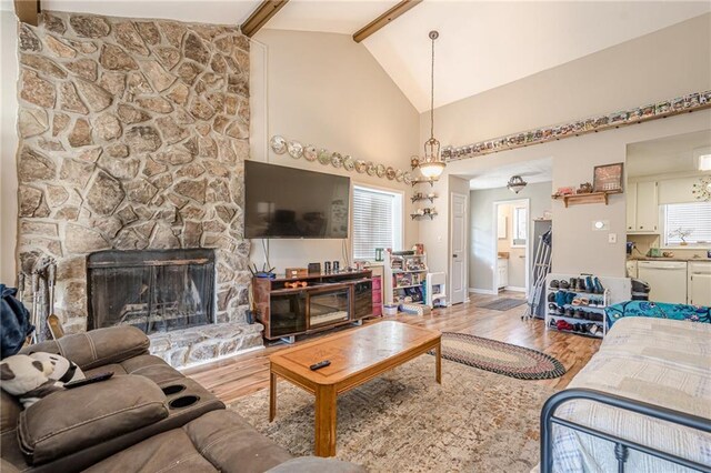 200 Villa Rd Unit 103, Jasper, GA 30143 - living room featuring light wood-style floors, beamed ceiling, a fireplace, baseboards, and high vaulted ceiling