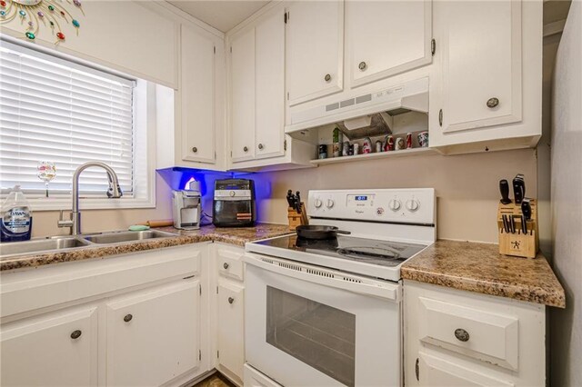 200 Villa Rd Unit 103, Jasper, GA 30143 - kitchen with white range with electric stovetop, under cabinet range hood, a sink, and white cabinets