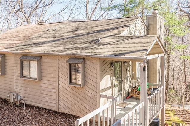 200 Villa Rd Unit 103, Jasper, GA 30143 - view of side of property with roof with shingles and a chimney