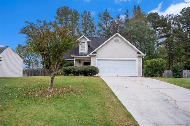 view of front of property featuring a garage and a front yard