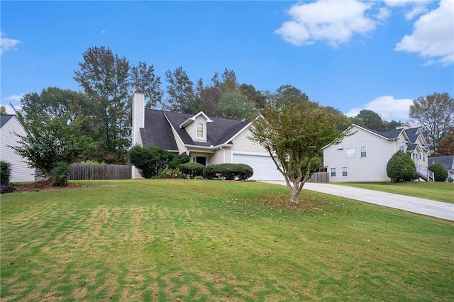 view of front of property featuring a garage and a front yard