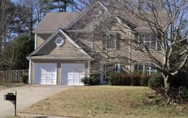 view of front of property with a garage