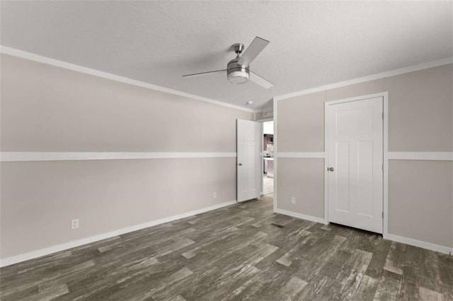 interior space with crown molding, dark hardwood / wood-style flooring, and ceiling fan