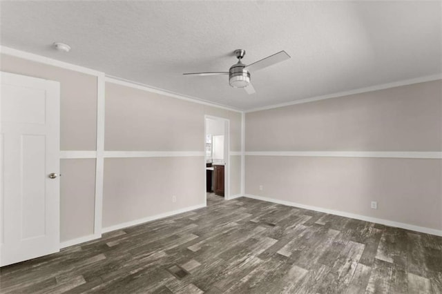 unfurnished room with a textured ceiling, dark hardwood / wood-style flooring, ceiling fan, and crown molding