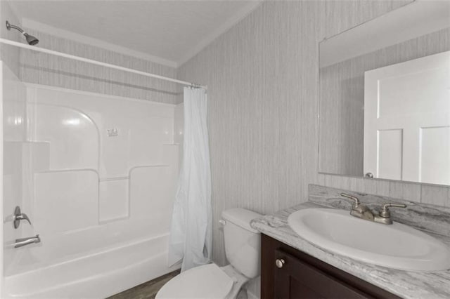 full bathroom featuring vanity, crown molding, wood-type flooring, shower / bathtub combination with curtain, and toilet