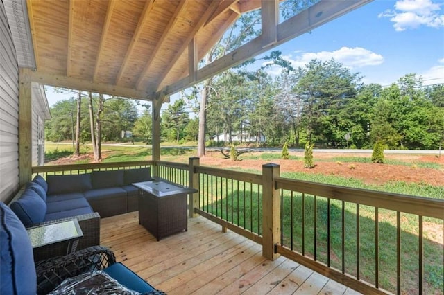 wooden deck with a yard and an outdoor hangout area