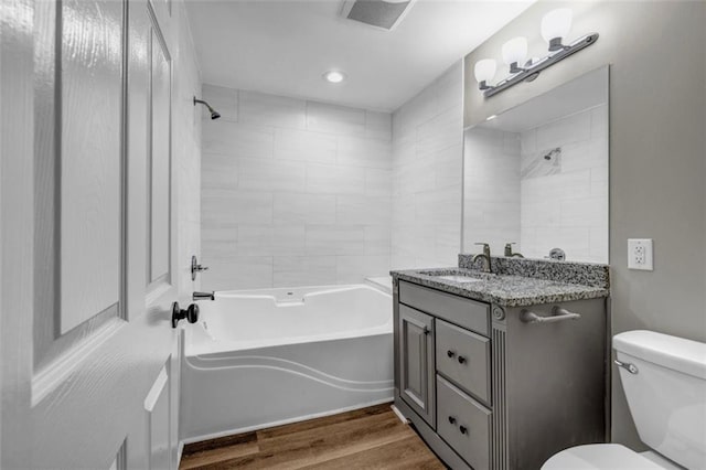 3927 Airline Rd, Mcdonough, GA 30252 - bathroom with toilet, vanity, wood finished floors, bathtub / shower combination, and recessed lighting