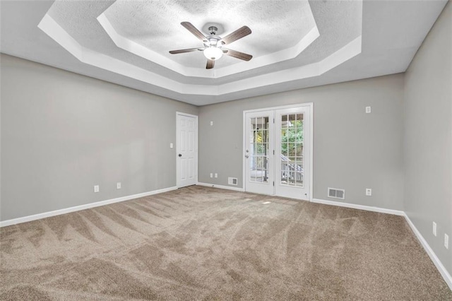 3927 Airline Rd, Mcdonough, GA 30252 - carpeted spare room with a textured ceiling, a raised ceiling, ceiling fan, and baseboards