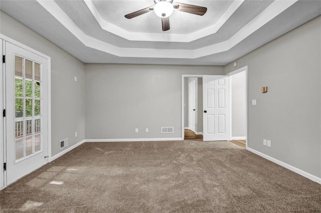 3927 Airline Rd, Mcdonough, GA 30252 - unfurnished room with a tray ceiling, carpet floors, a ceiling fan, and baseboards