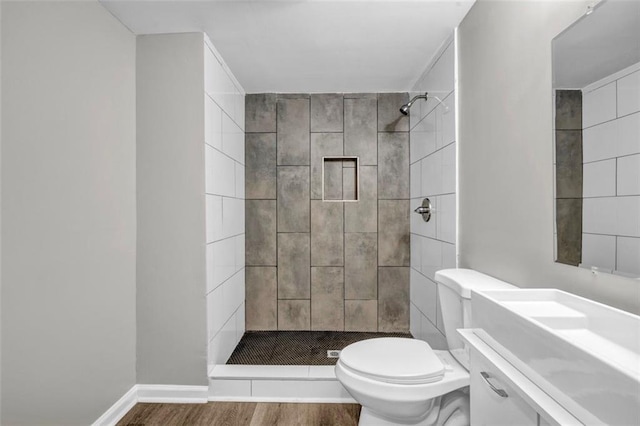 3927 Airline Rd, Mcdonough, GA 30252 - bathroom with toilet, wood finished floors, a stall shower, and vanity