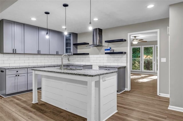 3927 Airline Rd, Mcdonough, GA 30252 - kitchen with open shelves, a sink, tasteful backsplash, light stone counters, and dark wood finished floors