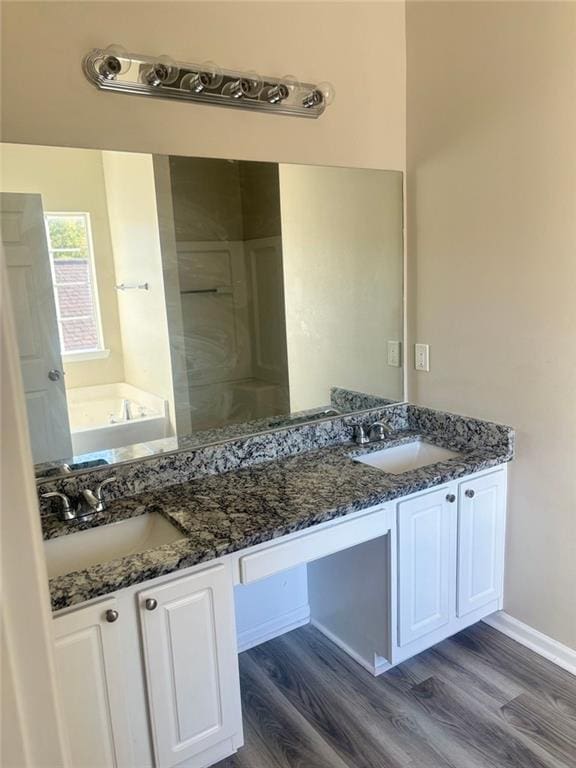 bathroom featuring vanity and hardwood / wood-style floors