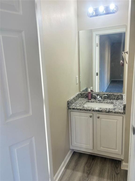 bathroom featuring vanity and hardwood / wood-style floors