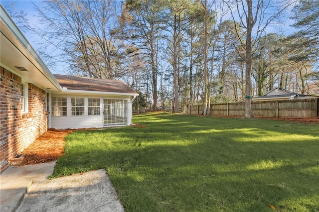 view of yard with a sunroom