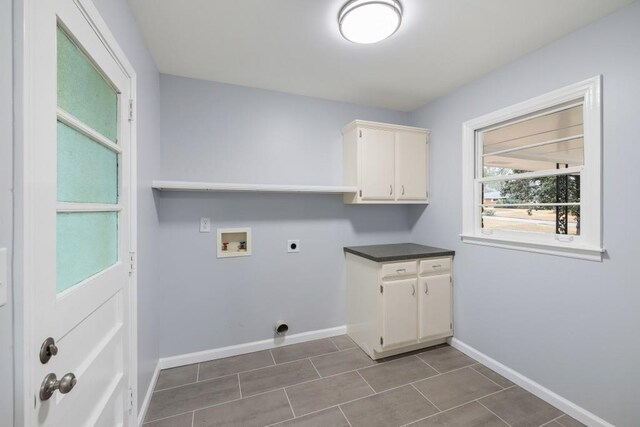 kitchen with stainless steel appliances, white cabinetry, a kitchen island with sink, and dark hardwood / wood-style flooring