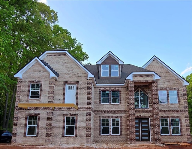 view of front of house with brick siding