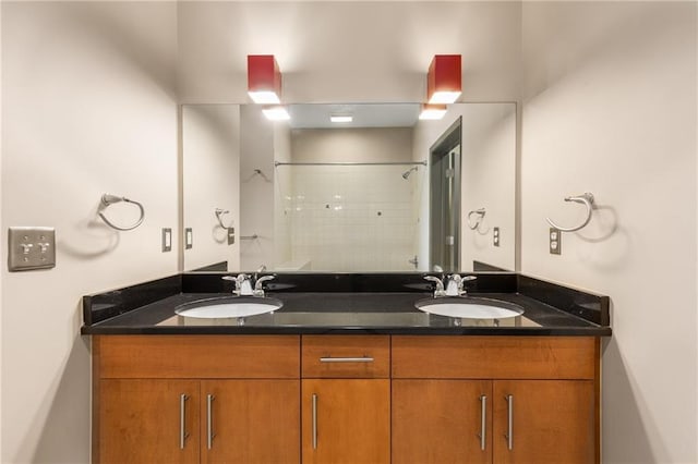 bathroom with vanity and a shower