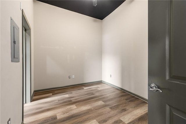 unfurnished room with wood-type flooring