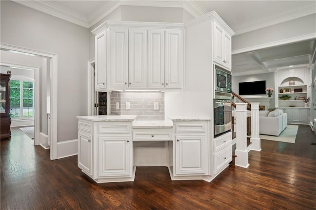 4555 Peachtree Dunwoody Rd, Sandy Springs, GA 30342 - kitchen with light stone countertops, dark wood-type flooring, white cabinetry, tasteful backsplash, and appliances with stainless steel finishes