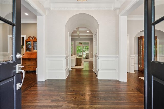 4555 Peachtree Dunwoody Rd, Sandy Springs, GA 30342 - foyer featuring crown molding, wainscoting, a decorative wall, wood finished floors, and arched walkways