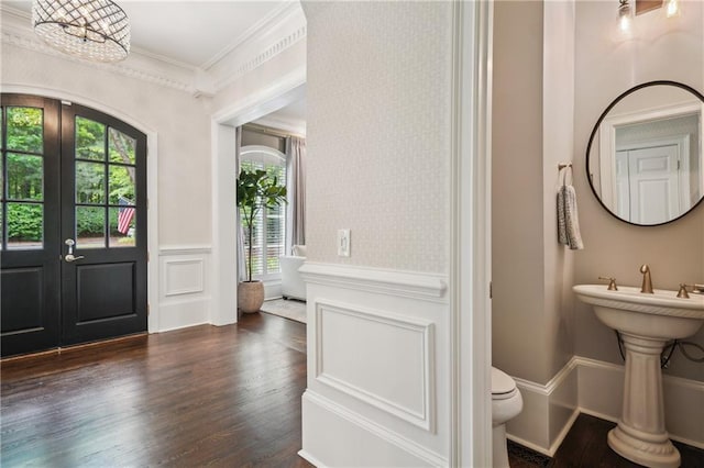 4555 Peachtree Dunwoody Rd, Sandy Springs, GA 30342 - entrance foyer featuring crown molding, french doors, plenty of natural light, and wood finished floors