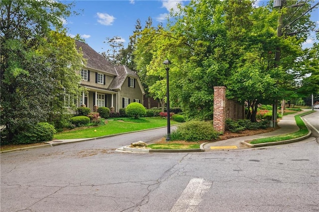 4555 Peachtree Dunwoody Rd, Sandy Springs, GA 30342 - view of street with street lighting, sidewalks, and curbs