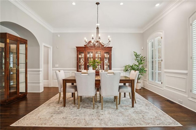 4555 Peachtree Dunwoody Rd, Sandy Springs, GA 30342 - dining space with ornamental molding, wainscoting, dark wood finished floors, and a chandelier
