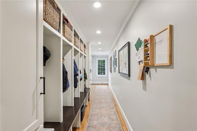 mudroom featuring recessed lighting, baseboards, light wood-style flooring, and crown molding