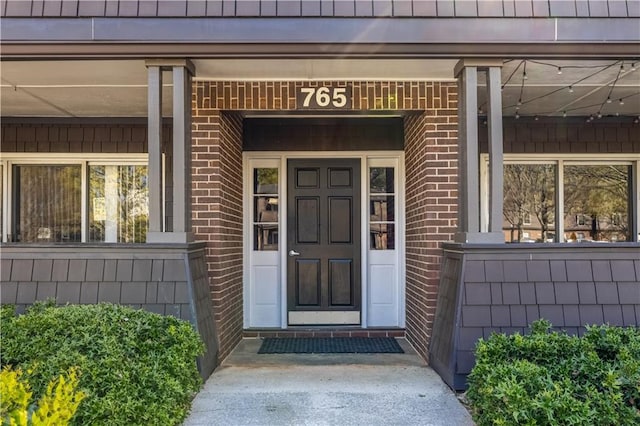 765 Houston Mill Rd NE Unit 7, Atlanta, GA 30329 - doorway to property with brick siding and covered porch